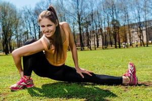 Woman doing stretching exercise outdoors