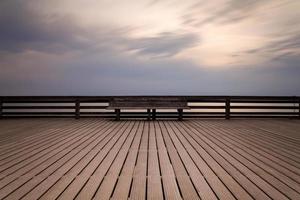 Wooden bench on planks photo