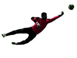 caucasian soccer player goalkeeper man punching ball silhouette
