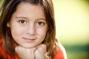 Real People: Smiling Caucasian Little Girl Outdoors Closeup Headshot photo
