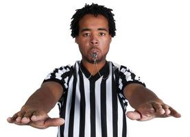 Black Male Referee Blowing a Whistle and Calling a Violation