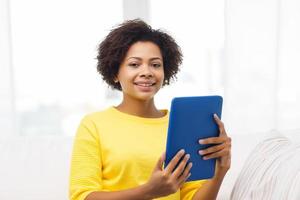 happy african american woman with tablet pc photo