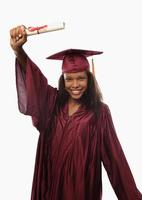 female college graduate in cap and gown photo