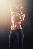 Fit woman with boxing gloves photo