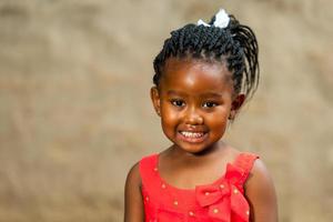 Little african girl with braided hairstyle. photo