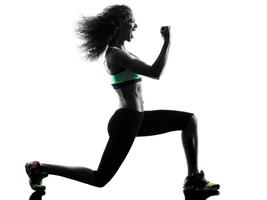 Silhouette profile of a female Zumba dancing and exercising photo