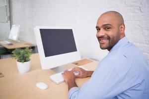 Businessman using computer at desk