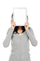 Woman covering her face with tablet computer photo