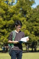 Asian student in park