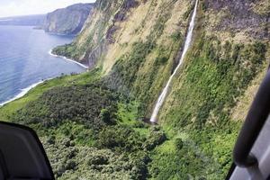 Coastal cliffs and waterfalls in Hawaii photo