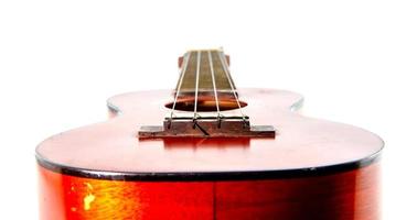 Old ukulele  on white background photo