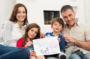 Family with new house drawing photo