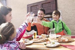 family cheers in a mountain chalet photo