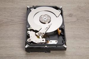 Open harddisk on wood desk photo