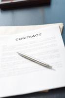 contract papers on wooden desk photo