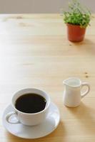coffee and milk on wooden table