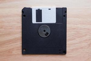 Floppy disk on wood photo