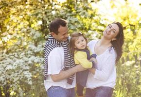 Happy family in nature photo