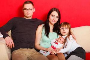 Family with newborn baby girl portrait photo