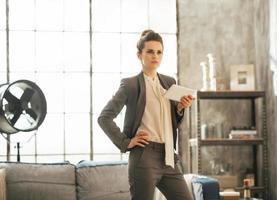 business woman with tablet pc in loft apartment photo