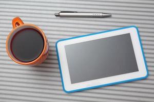 top view of  tablet pc and cup of tea photo