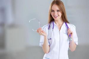 Smiling medical woman doctor at Hospital photo