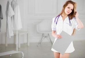 Beautiful woman doctor with electronic tablet