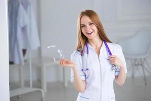 Smiling medical woman doctor at Hospital photo