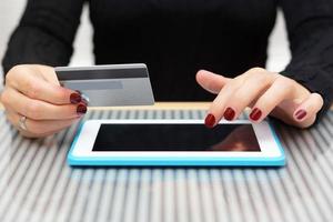 woman is using credit card for on line shopping