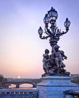 Parisian city lights on the Alexandre III bridge, Paris, France