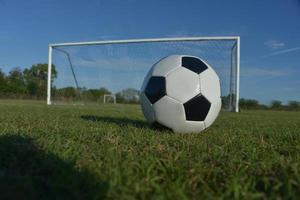 soccer ball in front of goal photo