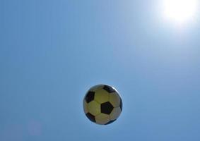 Soccer ball with sky as background.