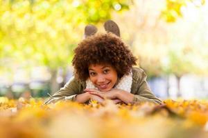 Autumn outdoor portrait of a African American young woman photo