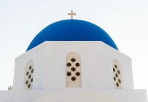 Typical blue cupola of a church in Santorini photo