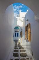 Mykonos streetview with arch and blue sky, Greece photo