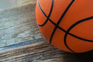 Closeup of Basketball on the Court Floor photo