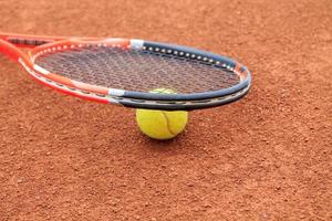Tennis ball and racket photo