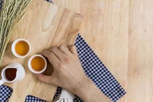 Taking Tea Cup on Wood Texture Background
