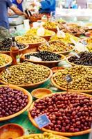 Different marinated olives on provencal street market in Provenc
