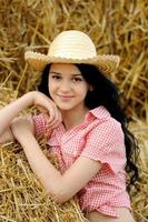 Beautiful girl enjoying nature in the hay