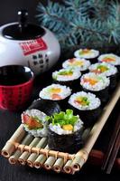 Vegetarian homemade sushi with avocado, tomato, peppers and lettuce. photo