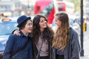 Multiracial group of girls walking in London photo