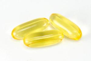 Cod liver oil omega3 gel capsules isolated on White background. photo