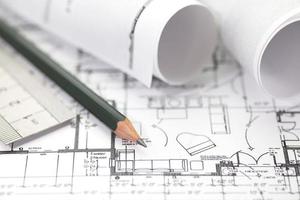 Architect rolls and plans construction project drawing photo