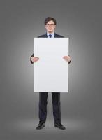 businessman holding blank placard photo