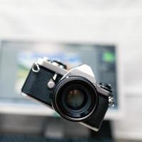 Camera, analog photography over new technology background photo