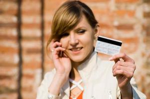 Girl with credit card and mobile phone