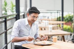 Indian businessman eating food photo