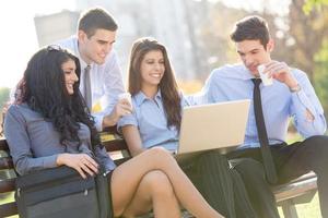 Young Business People On Park Bench photo