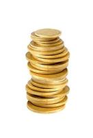 Many golden coins in column isolated on white background photo